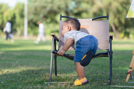 Little kid boy playing outdoors in the garden, Child boy in the parkの写真素材