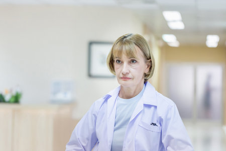 Portrait of Female doctor posing and standing at a hospital, Medical healthcare, and doctor serviceの写真素材
