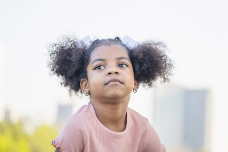 Cute little kid girl playing outdoors in the garden, Happy child girl in the park