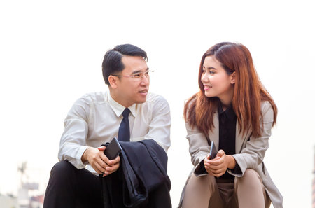 Business people meeting and sharing ideas, Young Asian business team discussing in the morningの写真素材