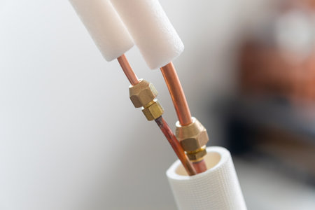 Closeup of copper pipe joints in air conditioner system, repairing servicing, and install new air conditioning conceptsの写真素材