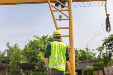 Back view of Engineer man in hardhats on construction site, Foreman checking project at the precast concrete factory siteの写真素材