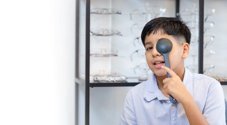 Indian kid boy choosing eyeglasses in optics store, Optometrist doing color blindness disease...