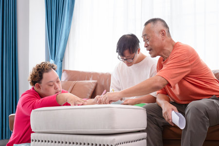 Senior man and grandchild practice math skill, interactive math game, Grandfather supervising...