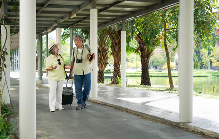 senior couple traveler with luggage walking in downtownの写真素材