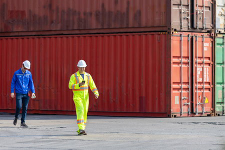 Workers inspecting shipping containers at port, Engineer man walking in industry containers cargo,...