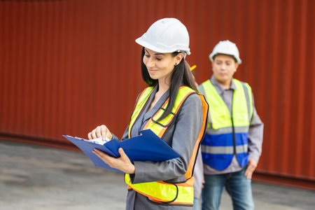 Female Logistics Professional Inspecting Containers Box, Woman in Industry Containers Shipping Yard,...