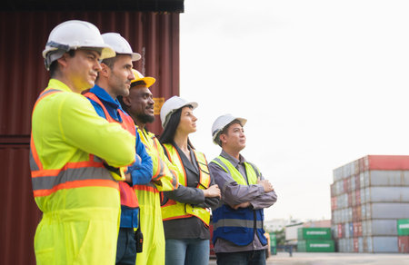 Successful Teamwork in Industrial and Shipping Industry, Diverse Team of Workers Standing With Arms...