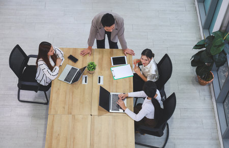 Teamwork and Brainstorming Concept with Businesspeople in Office Meeting, Creative Business Meeting with Team Discussing Ideas in Office Spaceの写真素材