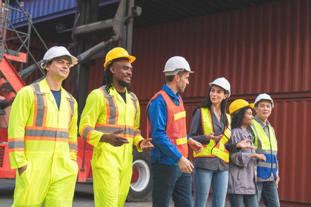 Engineer and foreman worker team in industry containers yard, Success teamwork conceptsの写真素材