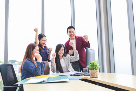 Cheerful Business Team Celebrating Success in Modern Office, Team Meeting and Brainstorming Concepts