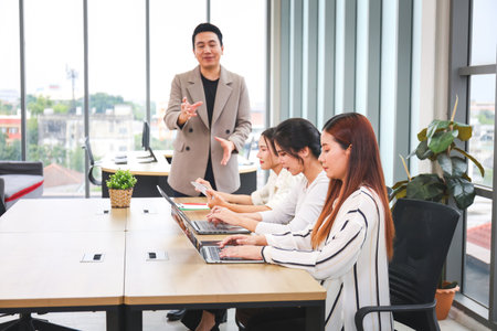 Startup Team Planning Project During Office Meeting, Young Asian Business Team Meeting in Officeの写真素材