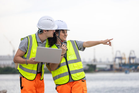 Industrial Workers Overseeing Operations at a Commercial Dock, Port Engineers Team Discussing...