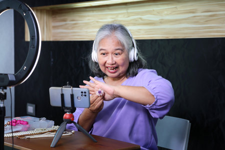 Senior Woman Live Streaming Jewelry Sale Online, Mature Female Vlogger Presenting Handmade Jewelry,...