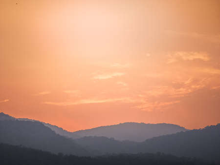 Beautiful orange sunset over the mountain, orange skyの写真素材