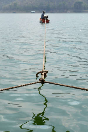 Pull floating house rafting to the destinationの写真素材