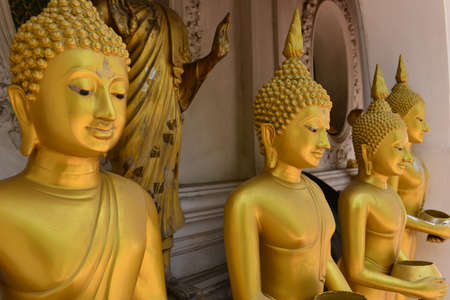 Buddha statue around the Golden pagoda Phra Pathom Chedi at Nakhon Pathom province, Thailand.の写真素材