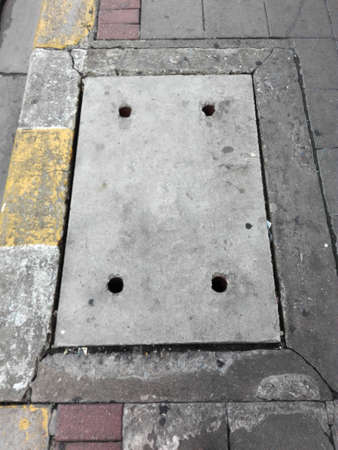 concrete pipe cap on footpathの写真素材