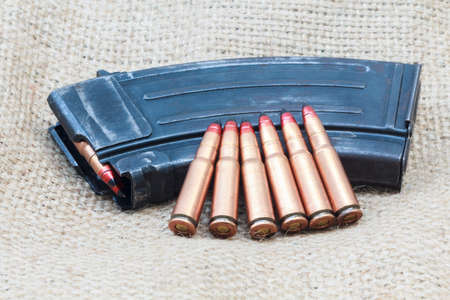 Rifle bullet and ammunition pouch. Choose a focal point ammunition lying.の写真素材