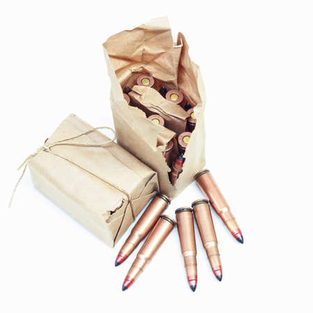 Rifle bullet   on white background:Choose a focal point ammunition lying.の写真素材