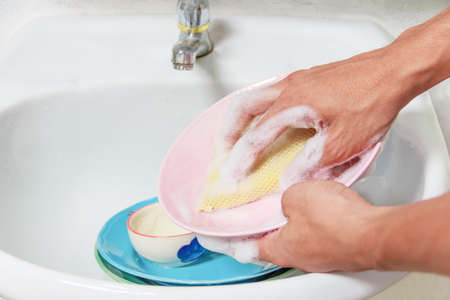 Man washing  dish.の写真素材