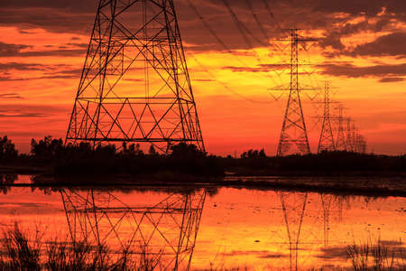 High voltage power lines at sunset.の写真素材