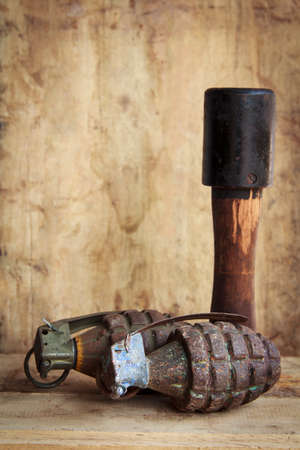 Grenade on old wood for background and textureの写真素材
