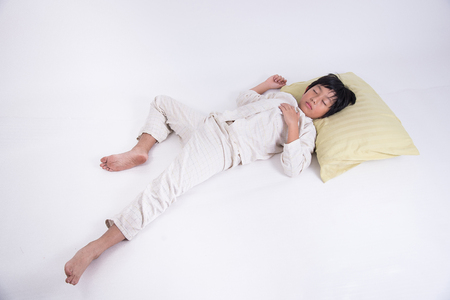 boy asian cute young bed child kid sleep bedroom sweet relax night peaceful dream pyjamasの写真素材
