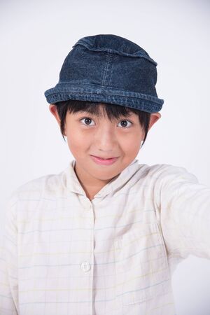 kid asian boy cute happy smile fun hatの写真素材