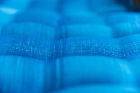 Blue bedding soft fabric backgroundの写真素材