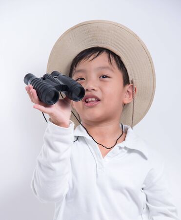 binoculars kid boy explorer traval fun looking hat asianの写真素材
