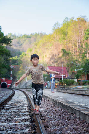 asian boy walk railway kid people travel cute rural way trainの写真素材