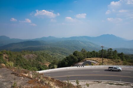 road mountain forest highway country travel tree nature carの写真素材