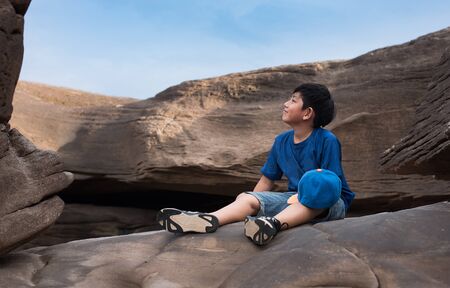 boy rock travel stone outdoor nature child mountain relaxの写真素材