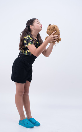 asian cute girl young kid happy portrait smile woman female pretty fun doll dogの写真素材