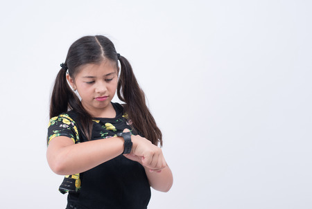 asian girl waiting looking watch time late checking hand wristwatch waitの写真素材