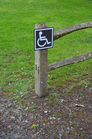 Disabled sign on exterior fence の写真素材