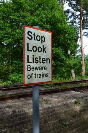 Stop look listen railway crossing sign の写真素材