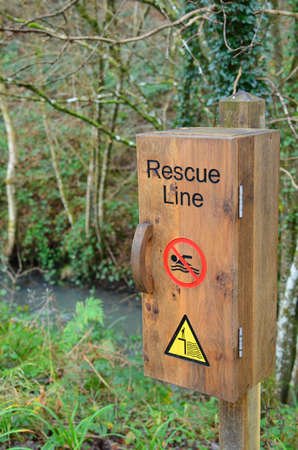 Emergency rescue line beside waters edge,