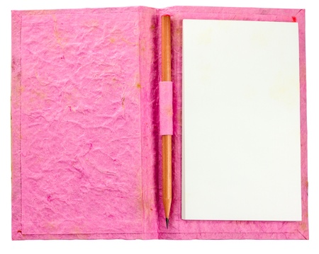 grunge pink notebook with pencil isolateの写真素材