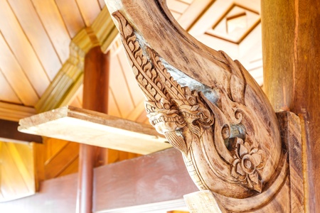 Ancient art on the wooden in Thai temple