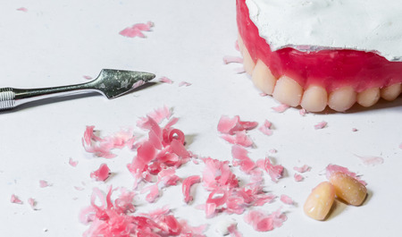 tool make a wax dentures model. table of dental technician workplace.の写真素材