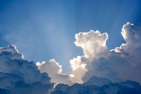 Blue sky with clouds and sun