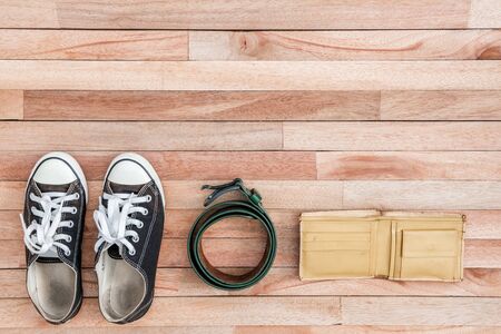 Vintage accessories on a wooden ,Shoes,belt and walletの写真素材