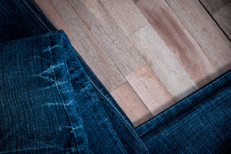 Texture of jeans on wooden backgroundの写真素材