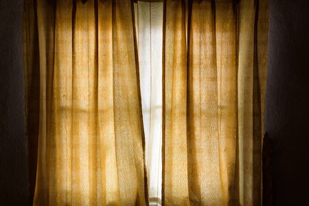 Vintage gold curtain background in homeの写真素材