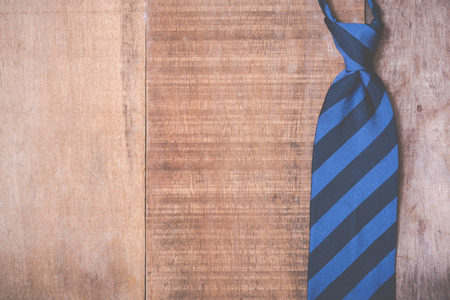 Necktie on grunge wood background