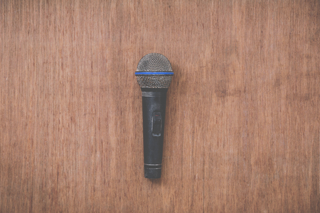 microphone on grunge wooden backgroundの写真素材