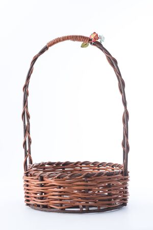 Empty wicker basket on white backgroundの写真素材