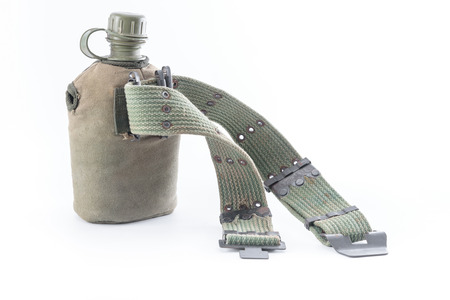 Military canteen and army belt on white backgroundの写真素材